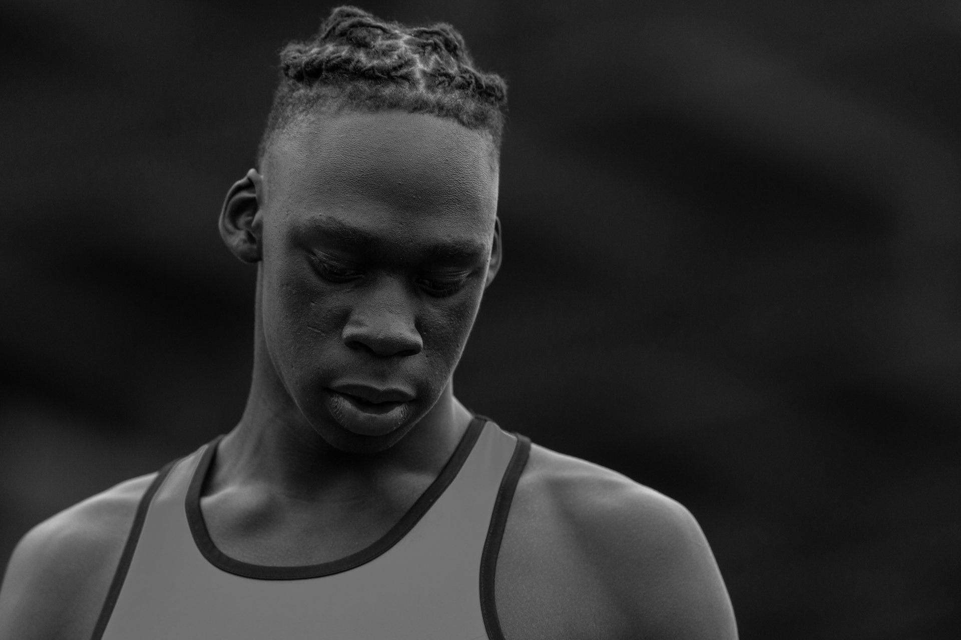 Moody black and white senior portrait of a male athlete in Olympia WA.