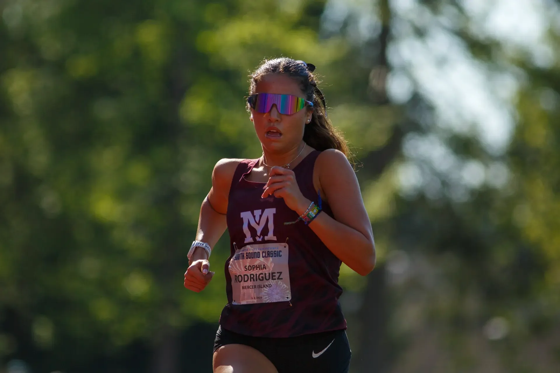 Sophia Rodriguez of Mercer Island running on a track. Top contender for the 2024 WIAA 3A Distance State Championships.