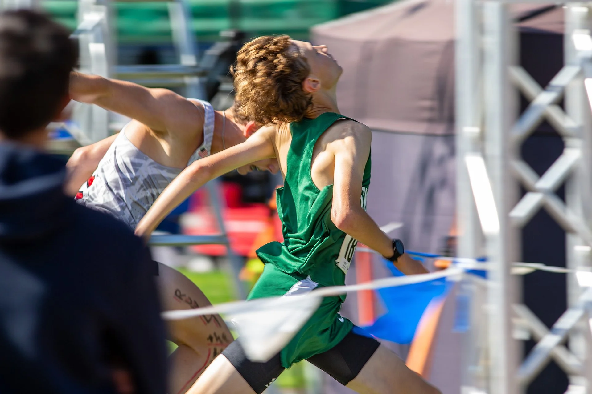 Two cross country runners sprinting neck and neck to the finish line at the Fort Steilacoom Invitational.