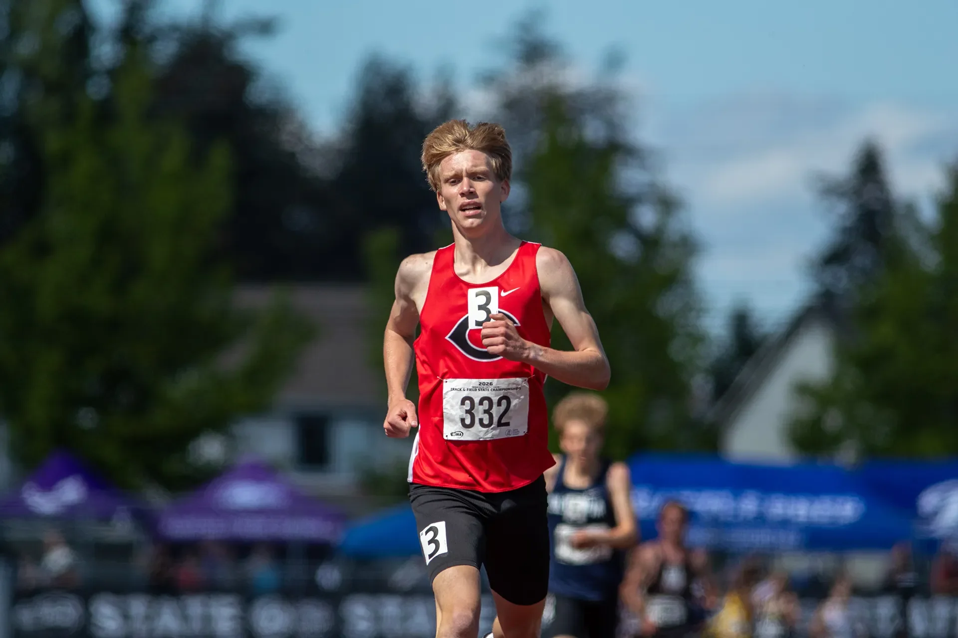 Cohen Butler of Camas High School running down the final stretch to set a new meet record in the 4A boys 3200M final.