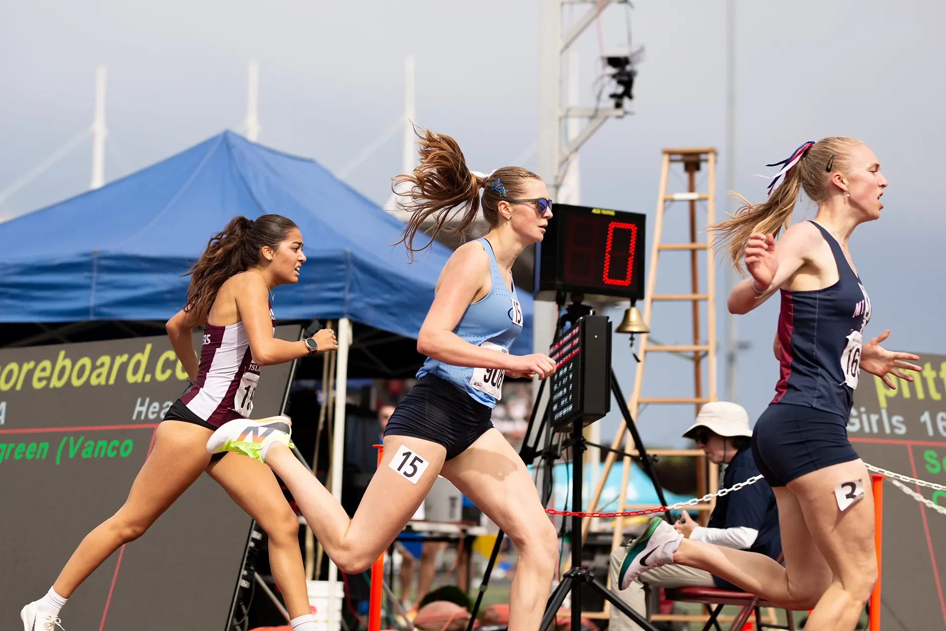 Jane Wycoff of Mt. Spokane crosses the finish line just ahead of Gig Harbor's Lejla Carlsson and Mercer Island's Sophia Rodriguez in the girls 3A 1600M state championship.