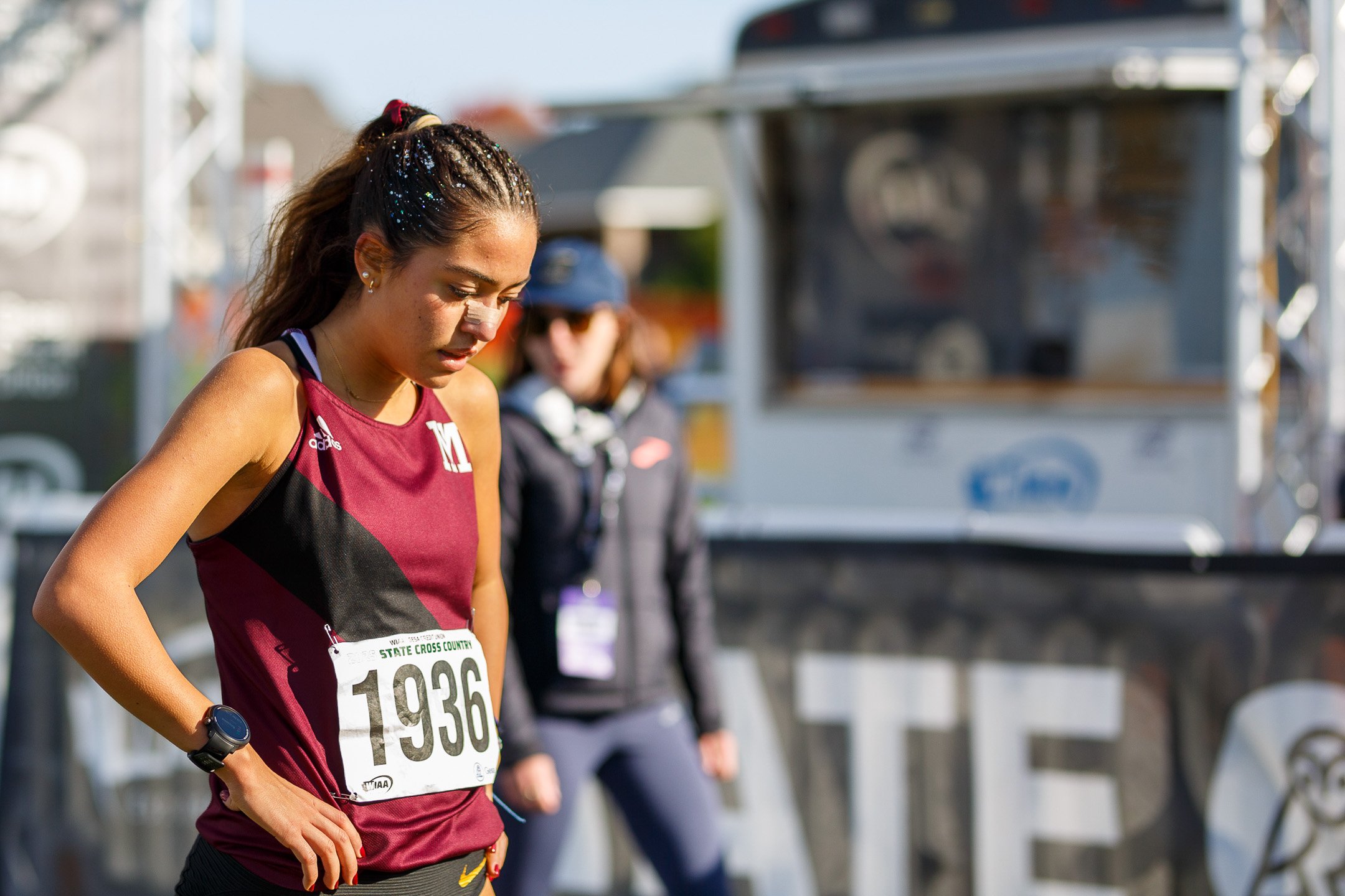 Sophia Rodriguez catching her breath in the finishing corral at the WIAA state cross country meet.