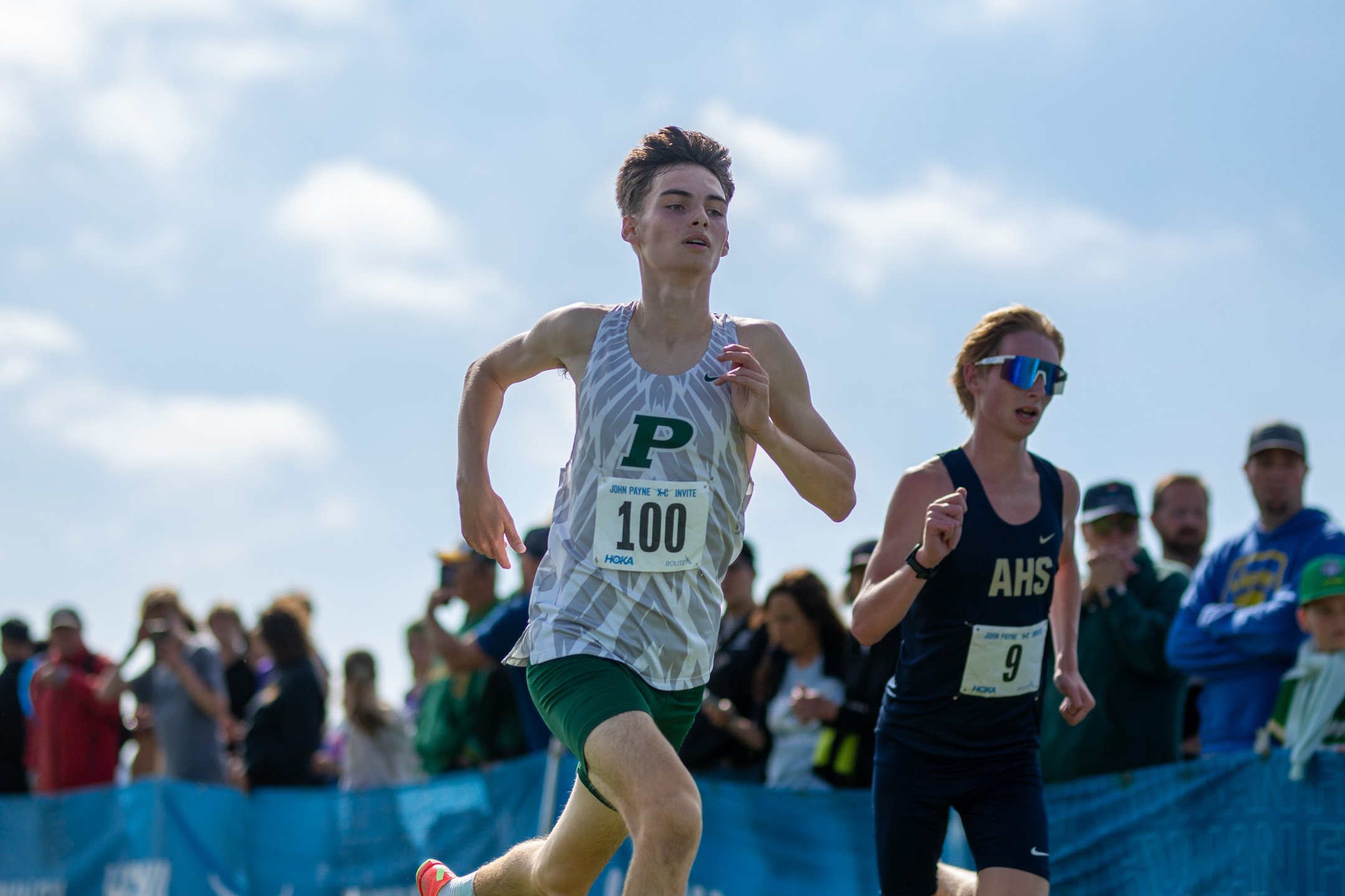 Peninsula sophomore Nolan Winderl, bib 100, racing at the HOKA John Payne XC Invitational.