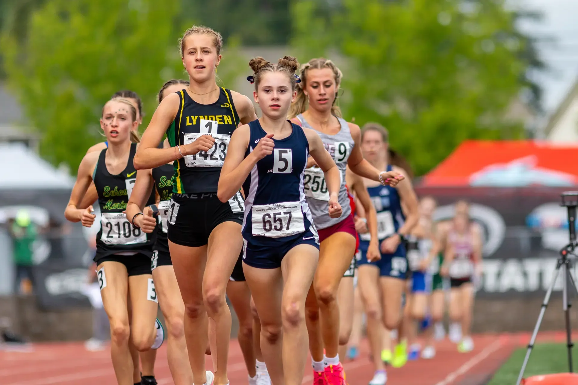 Grace Beachy of Ellensburg running on a track. Top contender for the 2026 WIAA 2A 3200m State Championships.