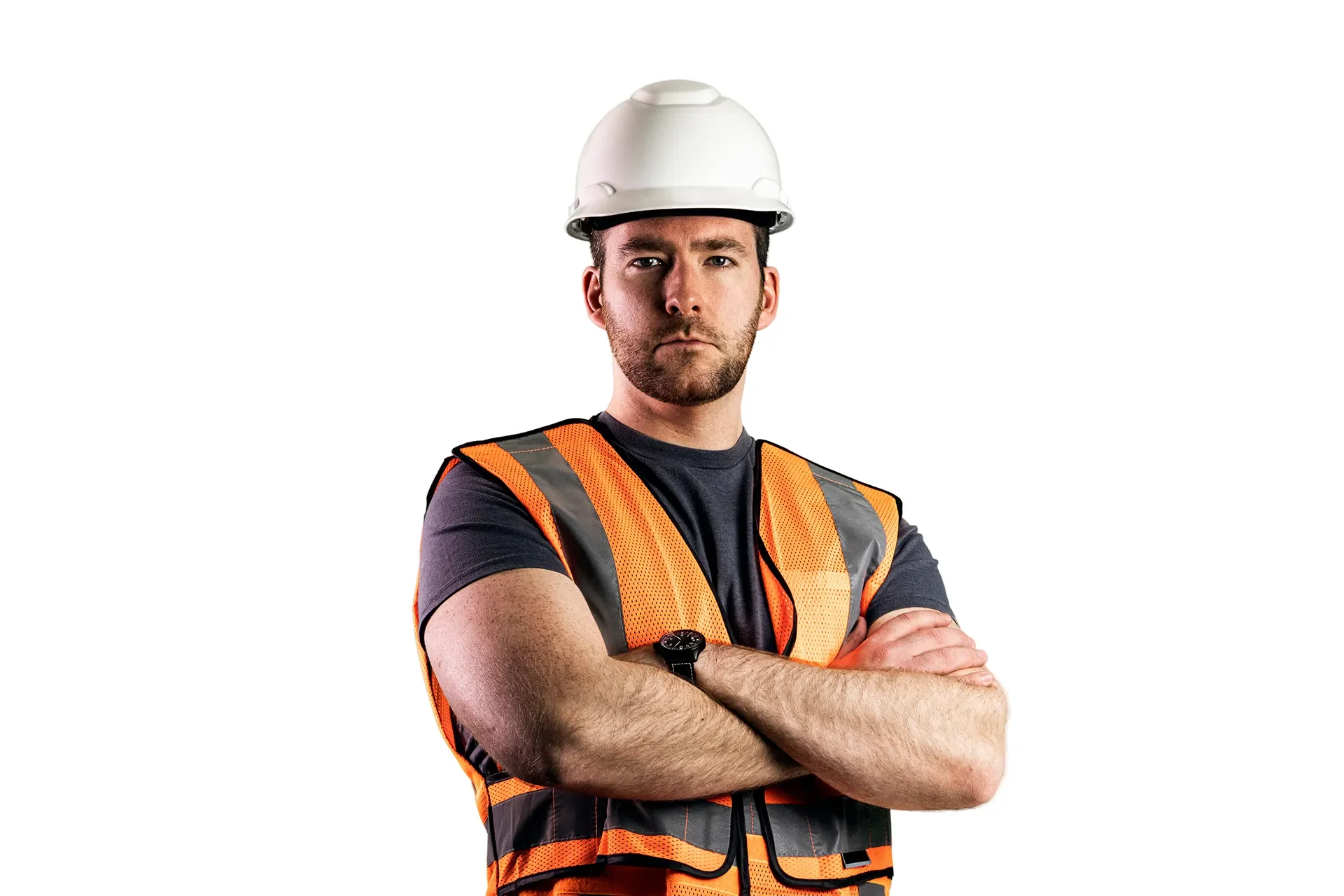 Studio stock photo of a male construction worker standing with arms crossed against a solid white background, wearing a spotless hard hat and safety vest.