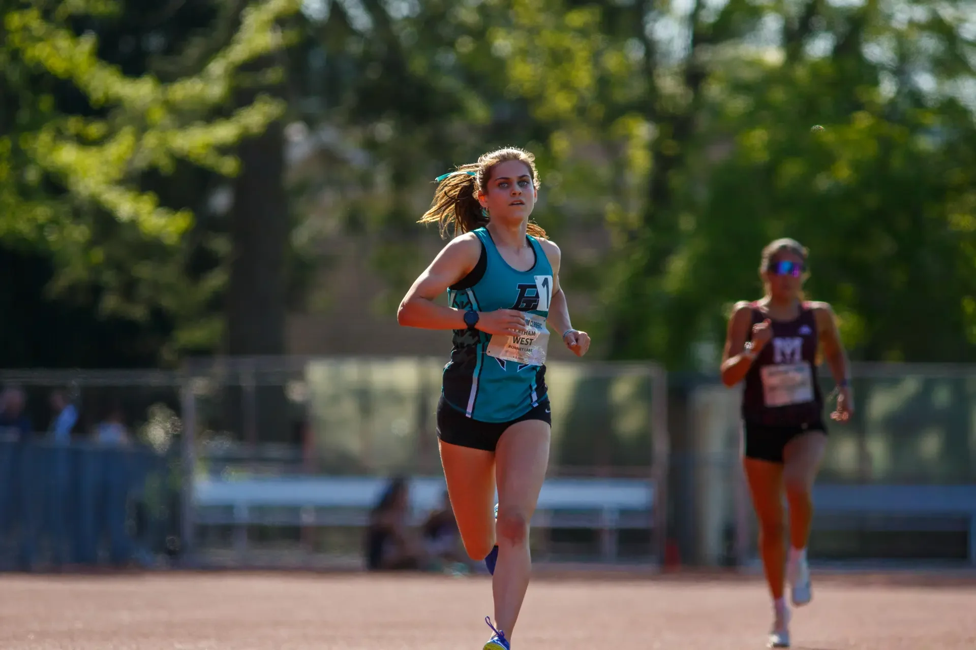 Latham West running at Sparks Stadium by Russell Moore Photography.