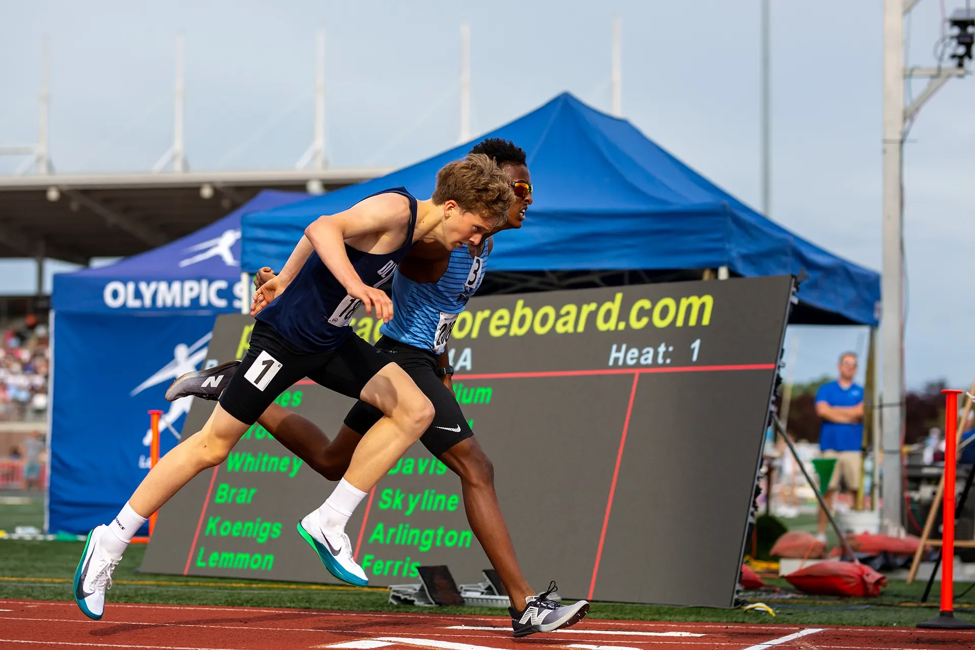 Amin Fidaar of Rogers High School finishing just ahead of Olympia's Quenton Lanese in the 4A boys 1600M final.