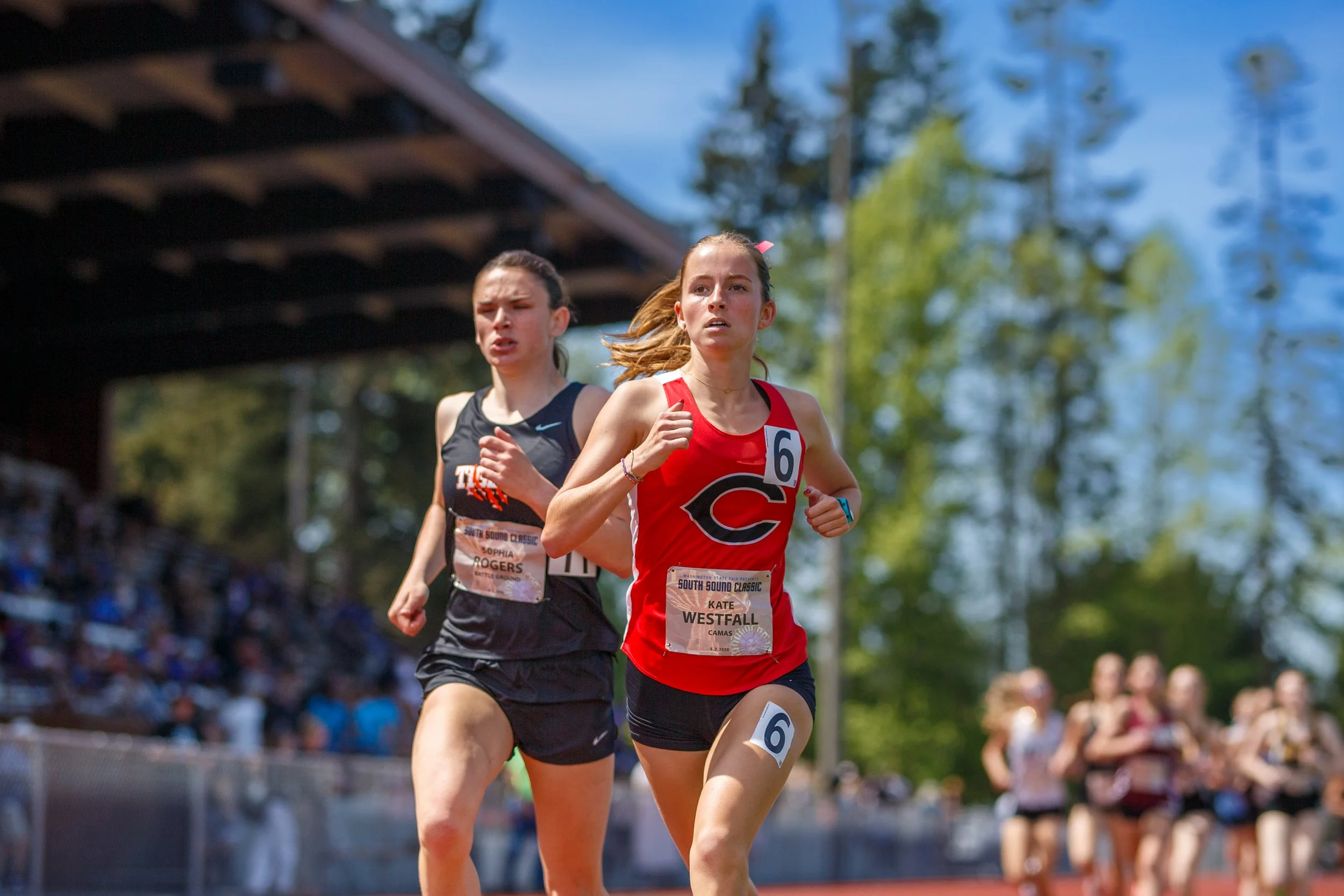 Sophia Rogers of Battle Ground and Kate Westfall of Camas racing at the district track and field championships.