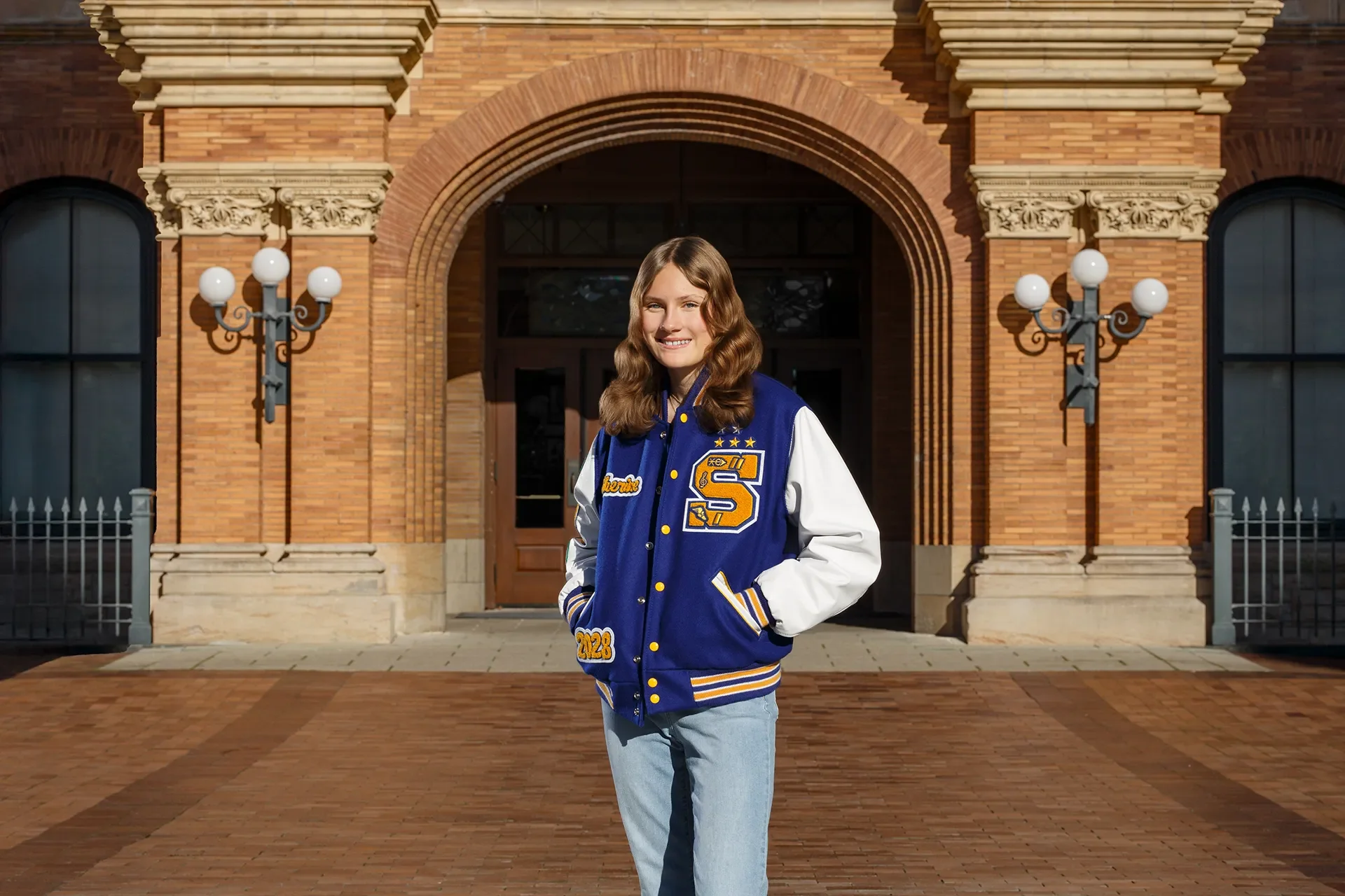 Class of 2027 editorial senior portrait of a student in a letterman jacket at Stadium High School in Tacoma, WA, photographed by Russell Moore Photography.