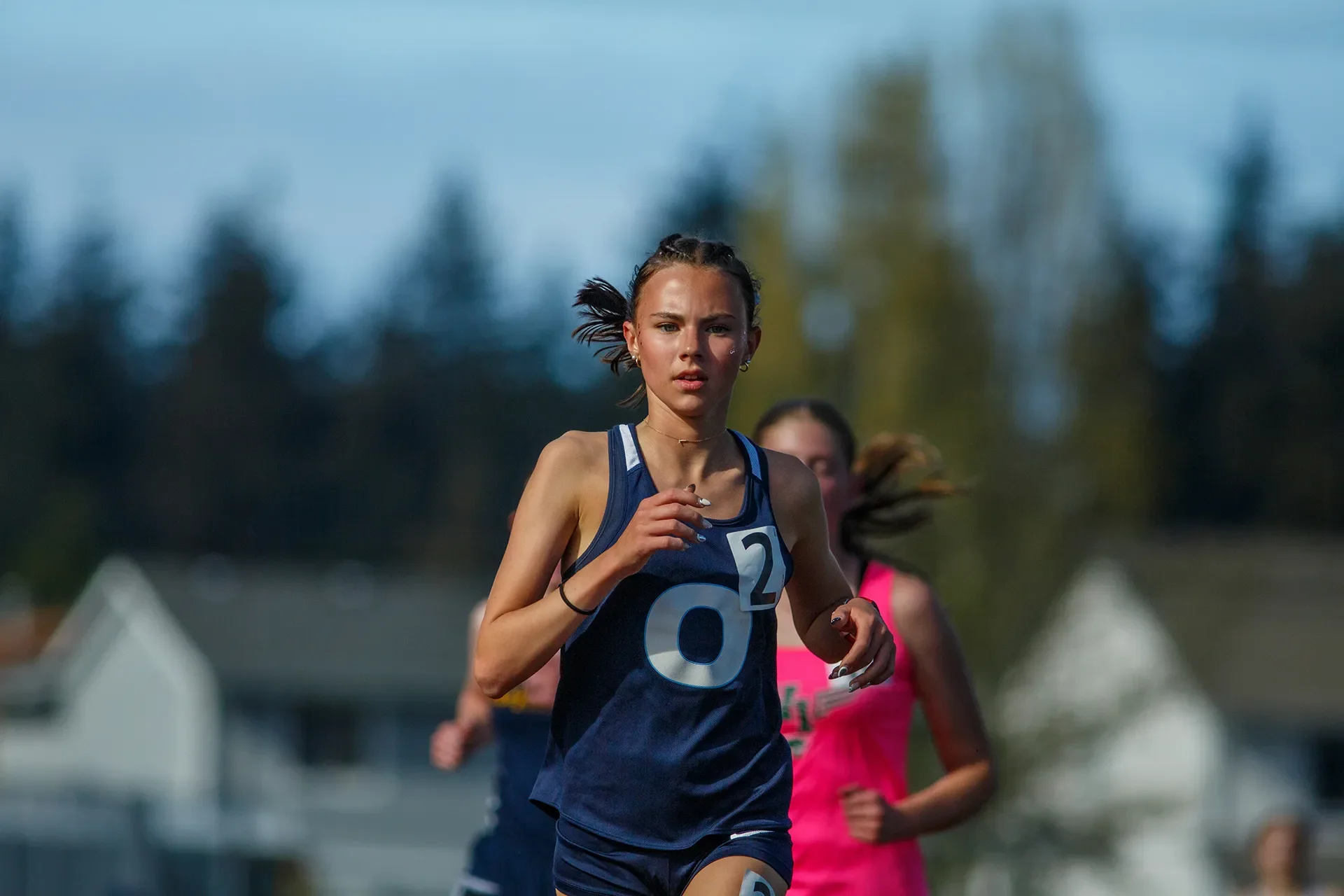 Washington high school track athlete Leah Hennan dictating the pace from the front of the pack at the Mt. Tahoma Track Festival.