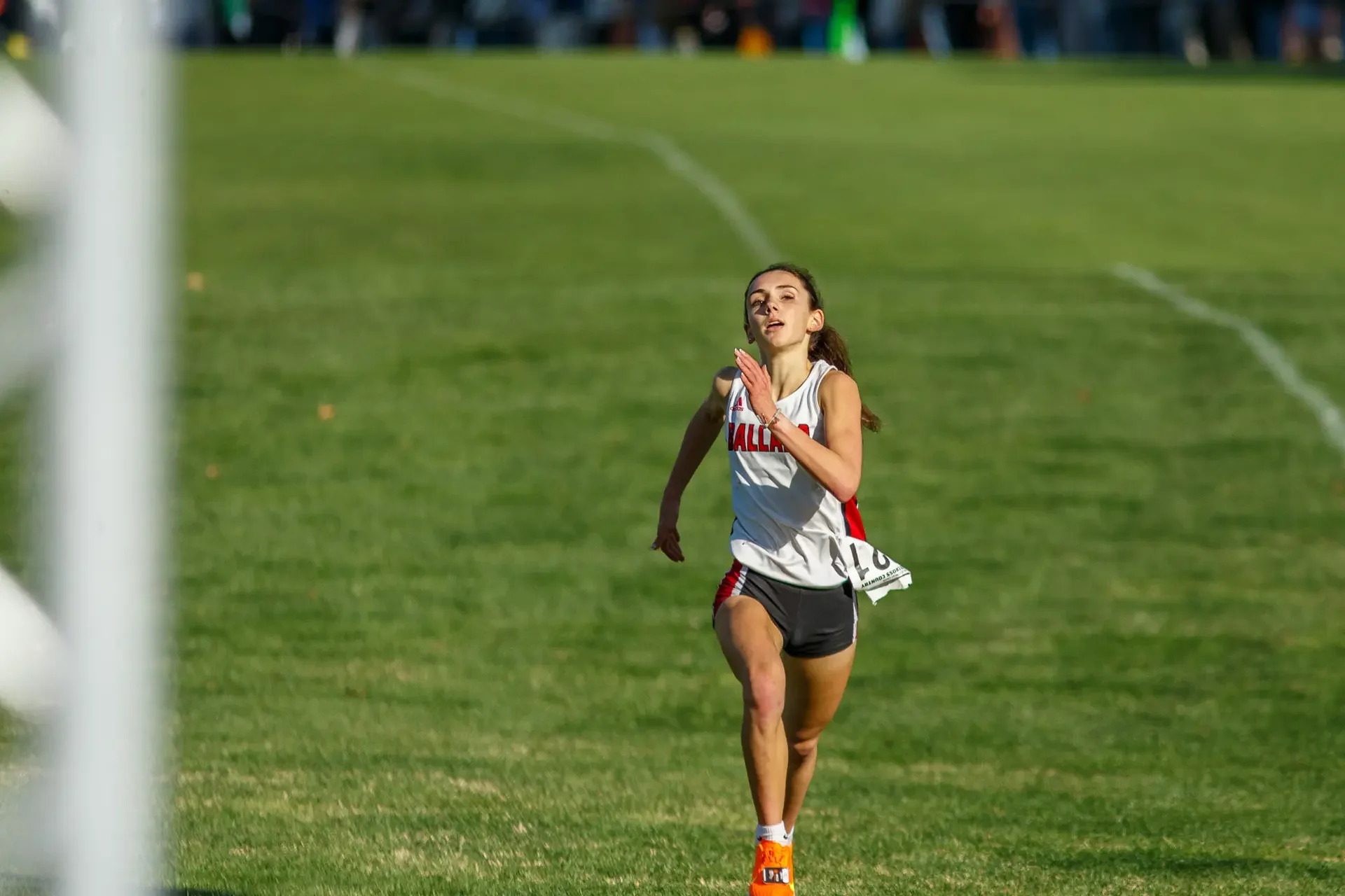 Cassidy Armstrong of Ballard running on a track. Top contender for the 2024 WIAA 3A 1600m State Championships.