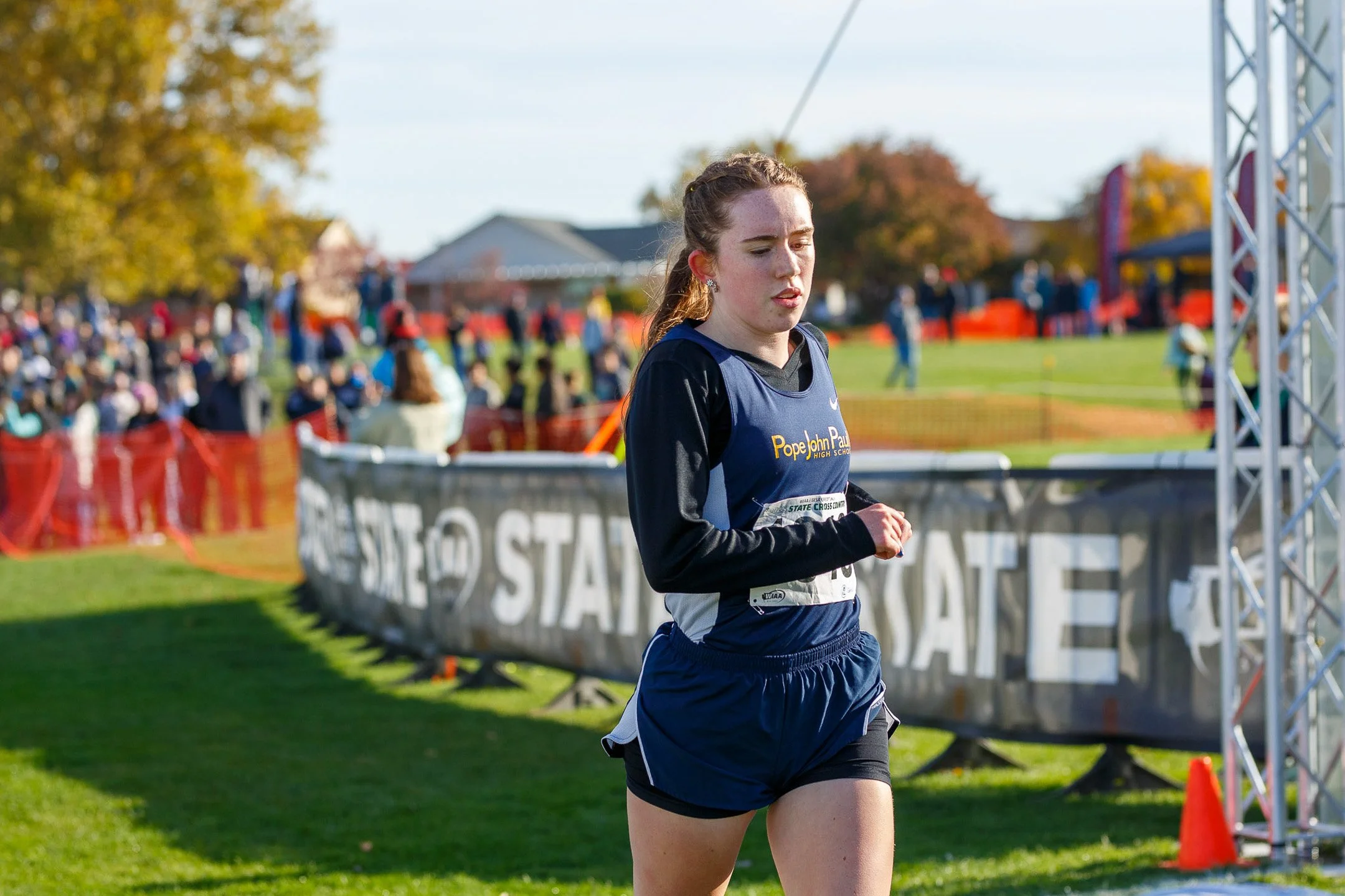 A high school cross country runner, Ruby Henry, competing at the WIAA state meet.
