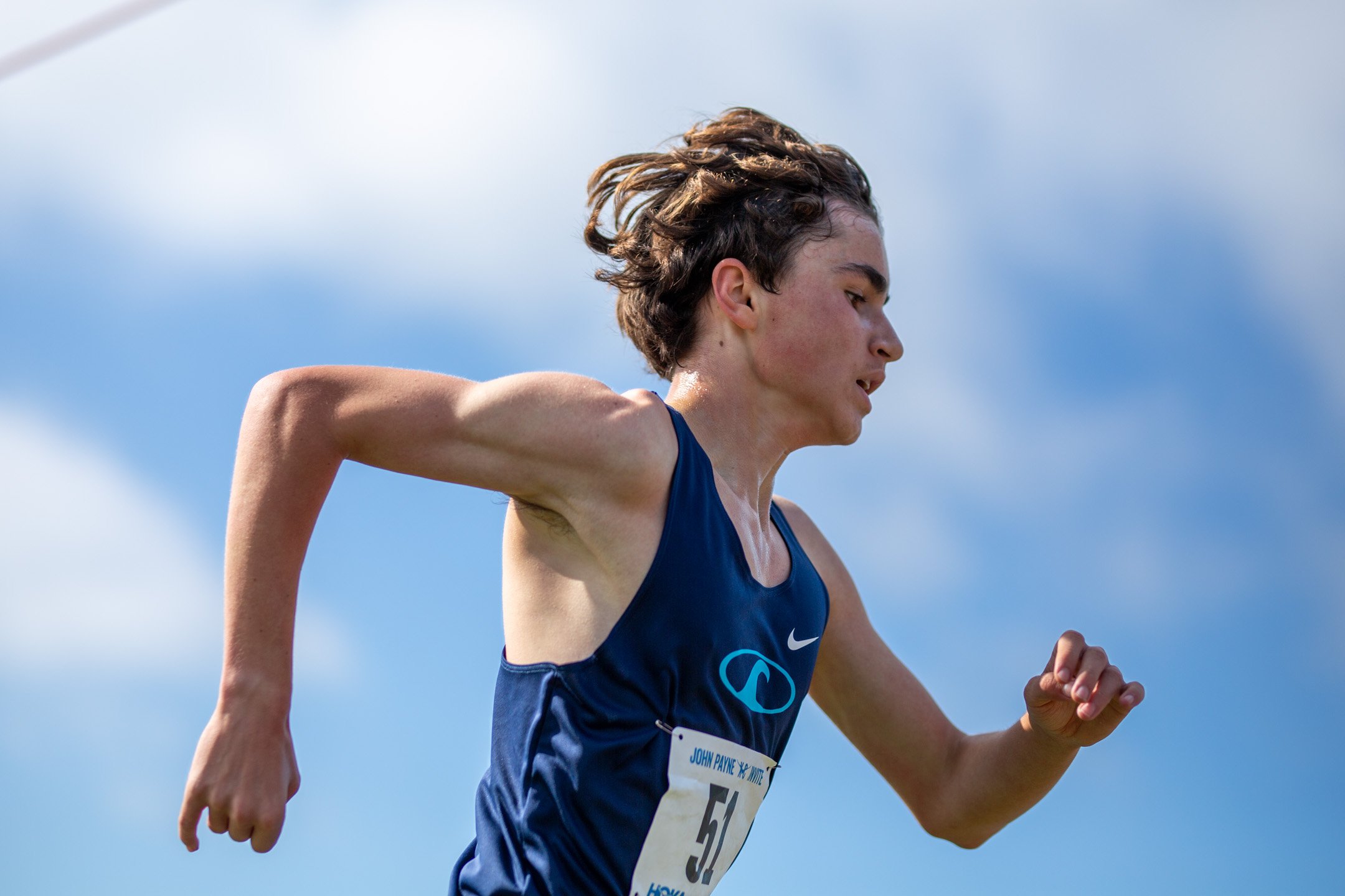 Gig Harbor junior Galen Peloquin, bib 51, racing at the HOKA John Payne XC Invitational.