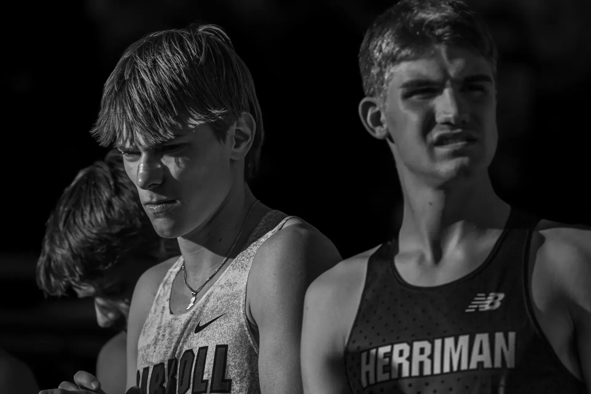 Caden Leonard and Jackson Spencer lining up at the start of the elite mile at Jesuit High School by Russell Moore Photography.