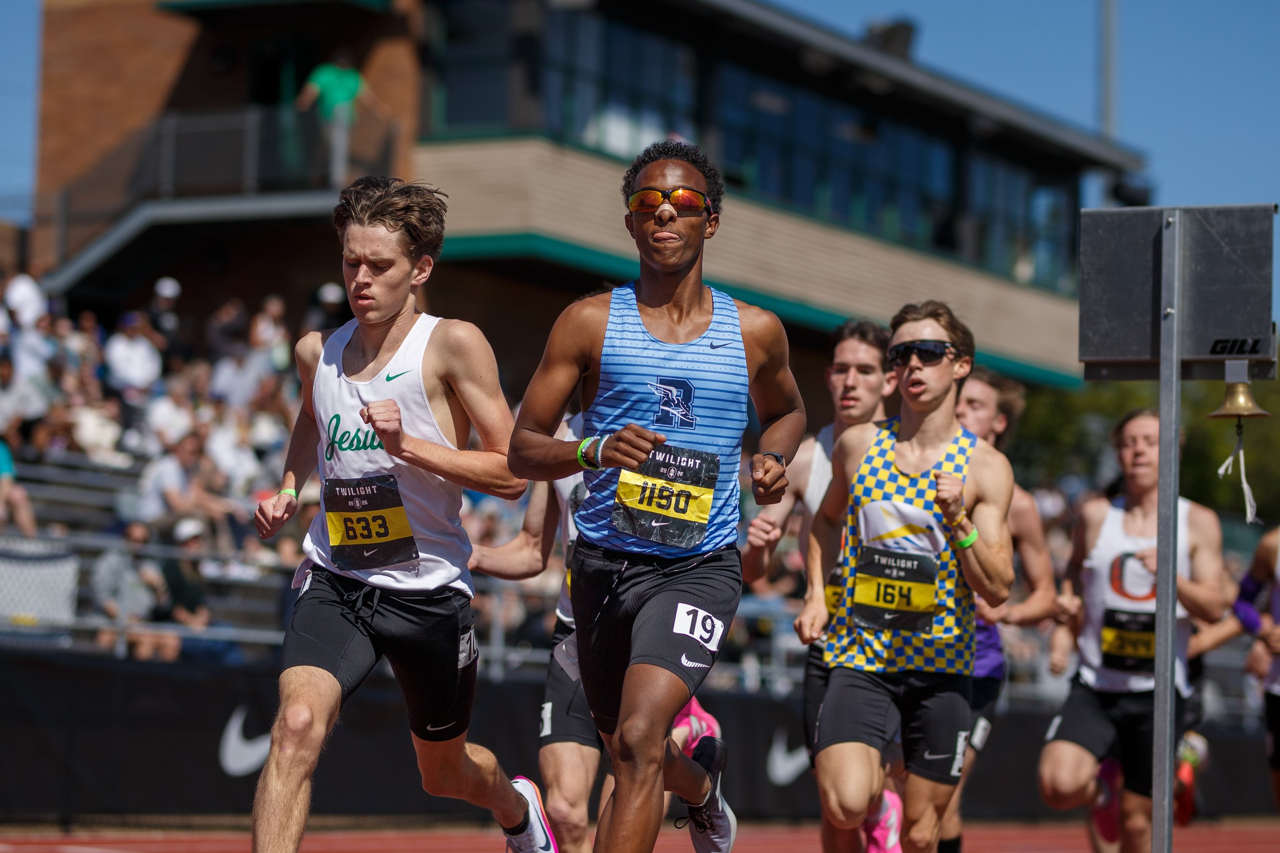 Rogers High School runner Amin Fidaar navigating a tight pack on the track, featured in the elite matchups preview for the 2026 South Sound Classic.