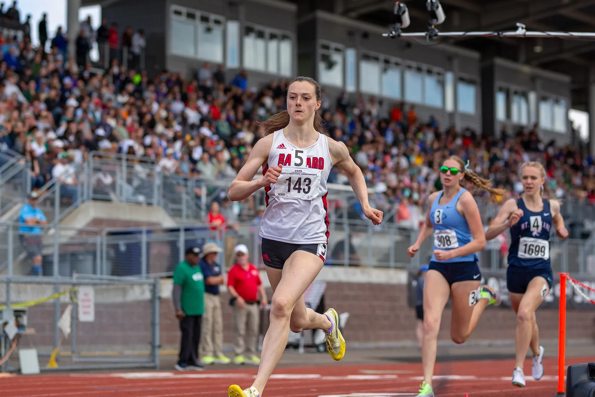 Ciana Johnson of Ballard High School crossing the finish line to win the 3A girls 800M state title.