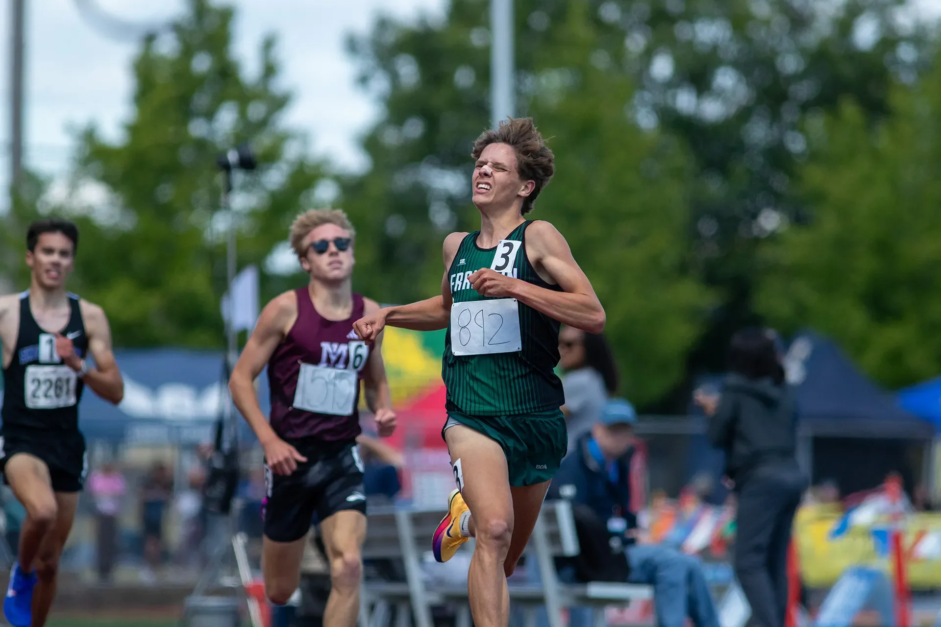 Kingston Shillito of Franklin High School sprinting on the final lap to win the 3A boys 3200M state championship.