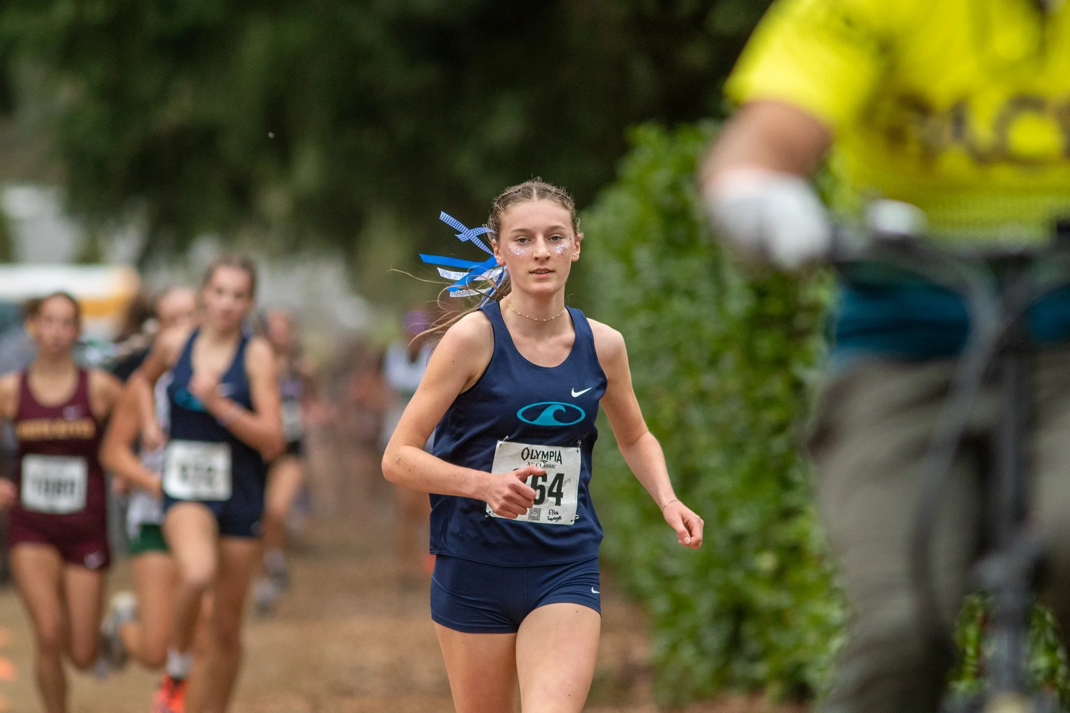 Gig Harbor runner Ella Savage finishing ahead of the field at the Olympia XC Classic junior race.