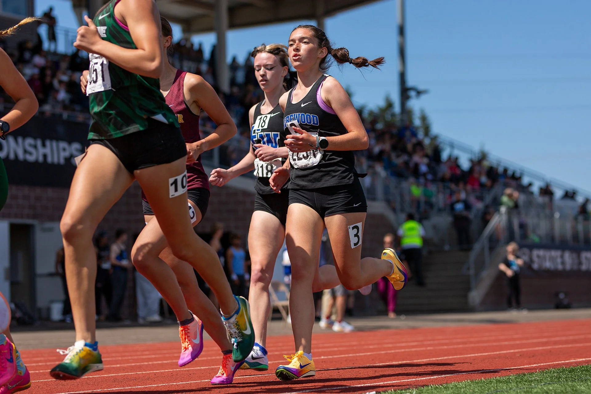 Olivia Decker of Shorewood High School running in the lead pack during the girls 3200m at the WIAA 3A State Championships, 2026.