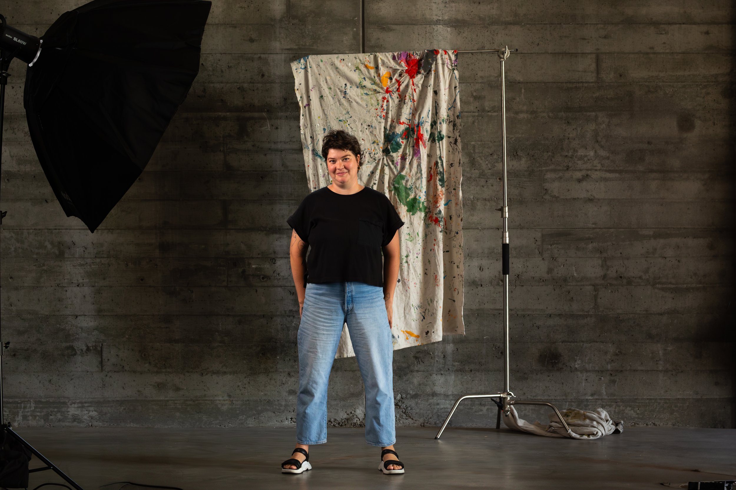 Portrait of Fern Tallos, muralist and artist, photographed at the Olympia, WA Armory.