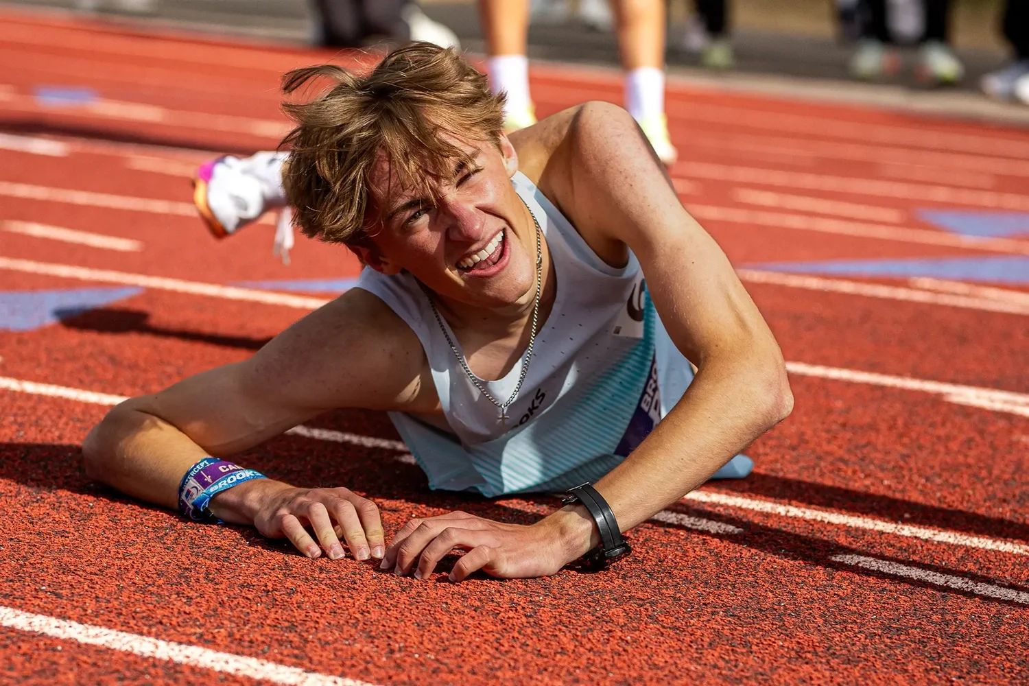 Dylan Rowell lying on the track surface after a sub-four-minute mile at Brooks PR Invitational 2026