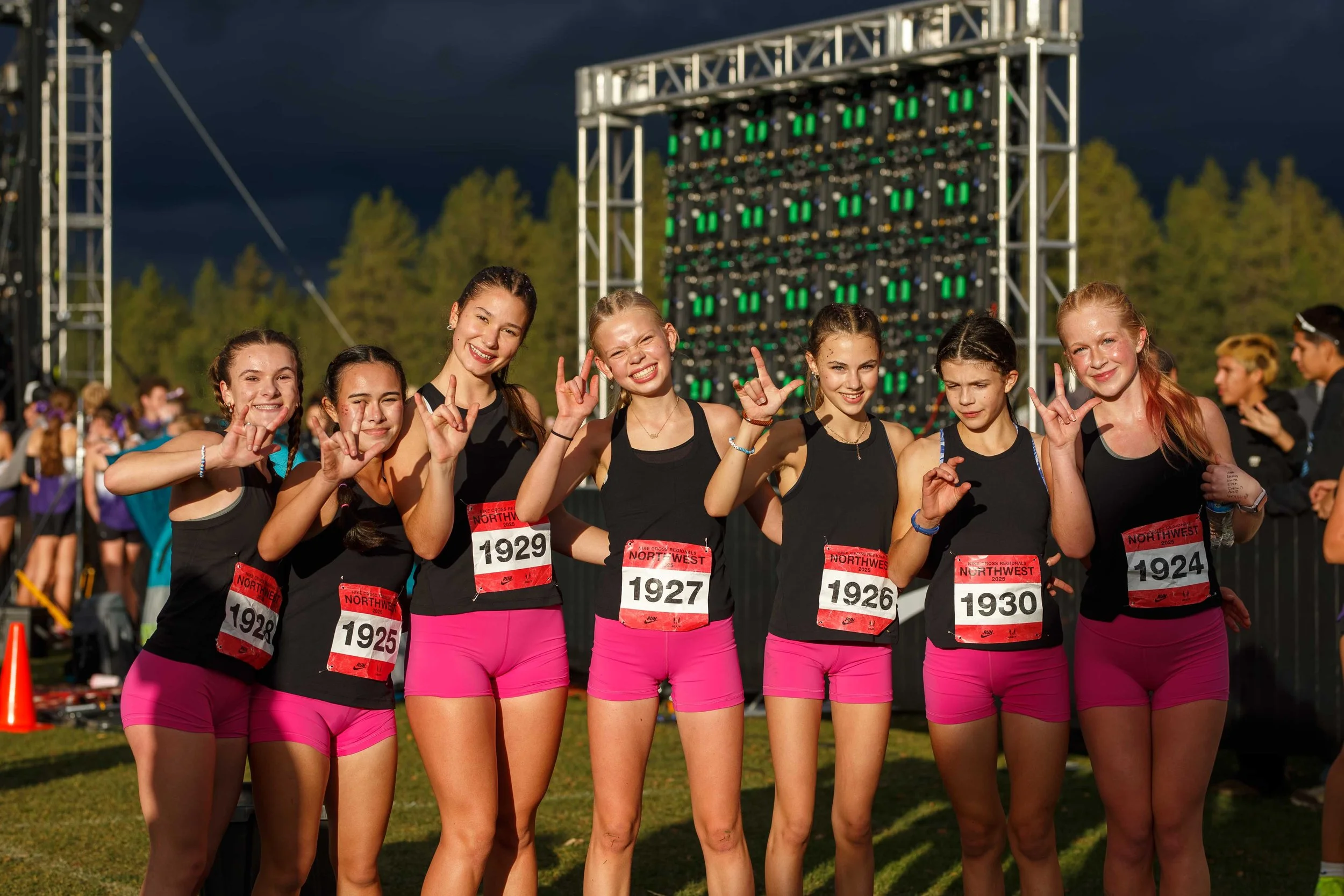 Olympia High School girls cross country team celebrating together at the NXR Northwest meet.