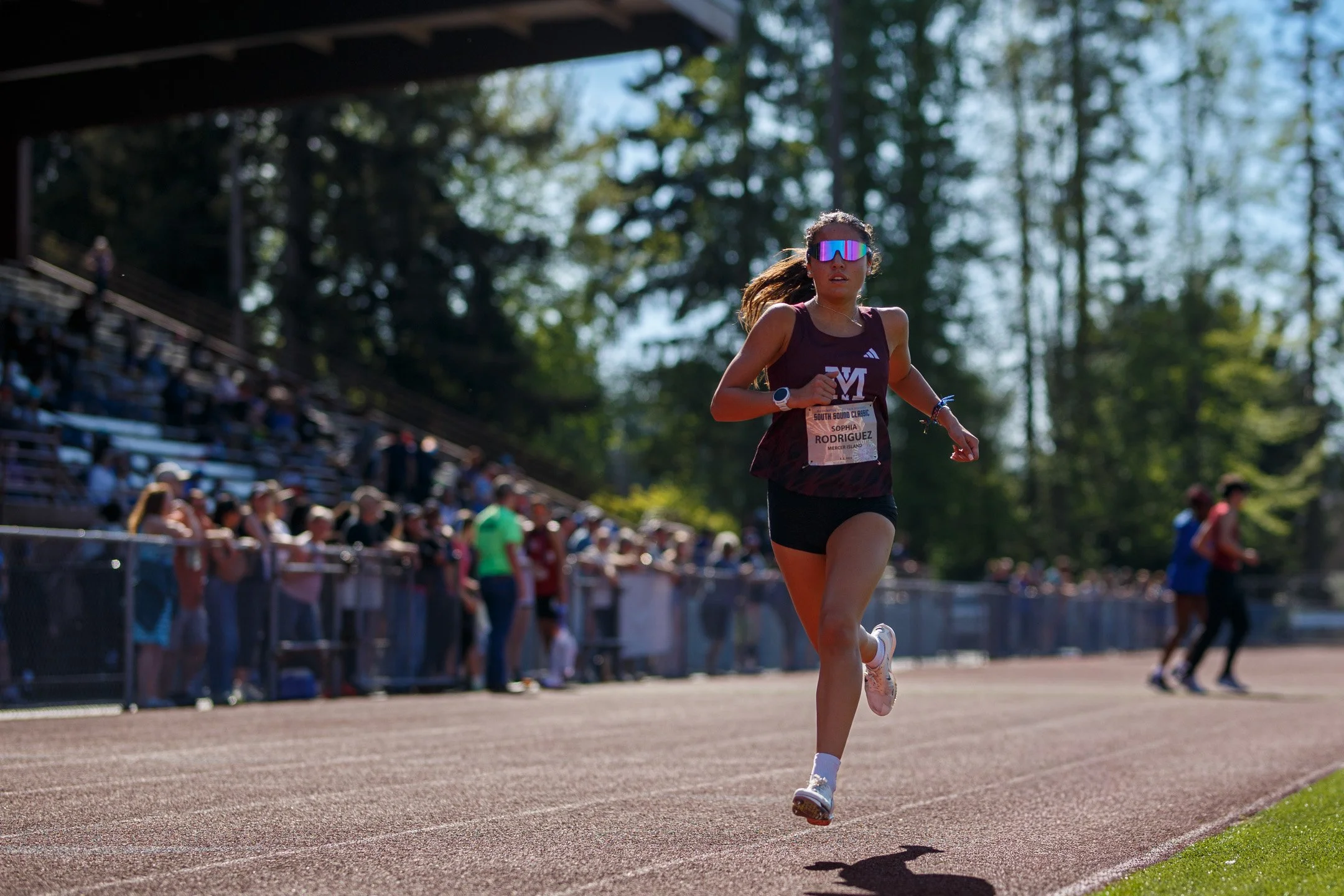 High school athlete competing in a track and field event at the South Sound Classic meet at Sparks Stadium in Puyallup, Washington.