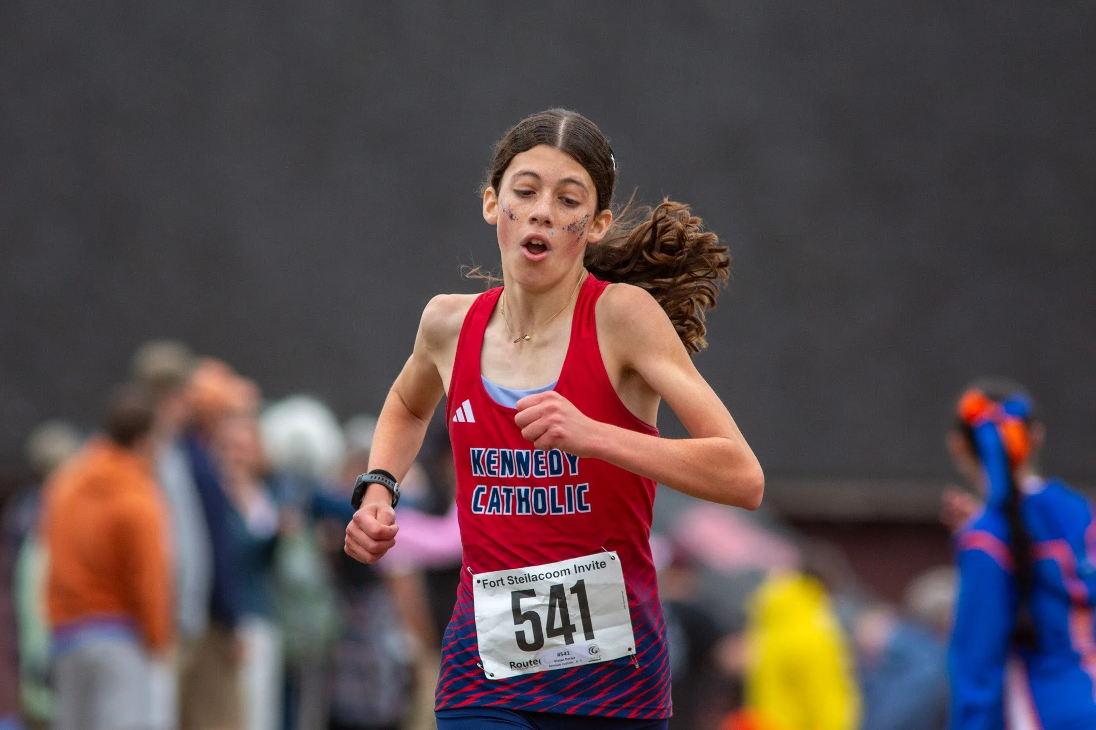 High school athlete competing in a cross country race at the Fort Steilacoom Invitational at Fort Steilacoom Park in Lakewood, Washington.