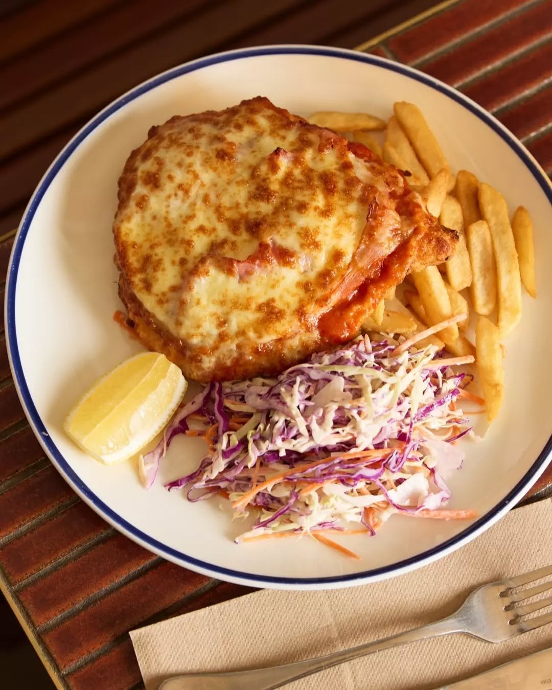 Pass us a parmi! The national treasure that is the Chicken Parmigiana in all its cheesy glory. Served with slaw and fries.

📍 Public Bar &amp; Beer Garden