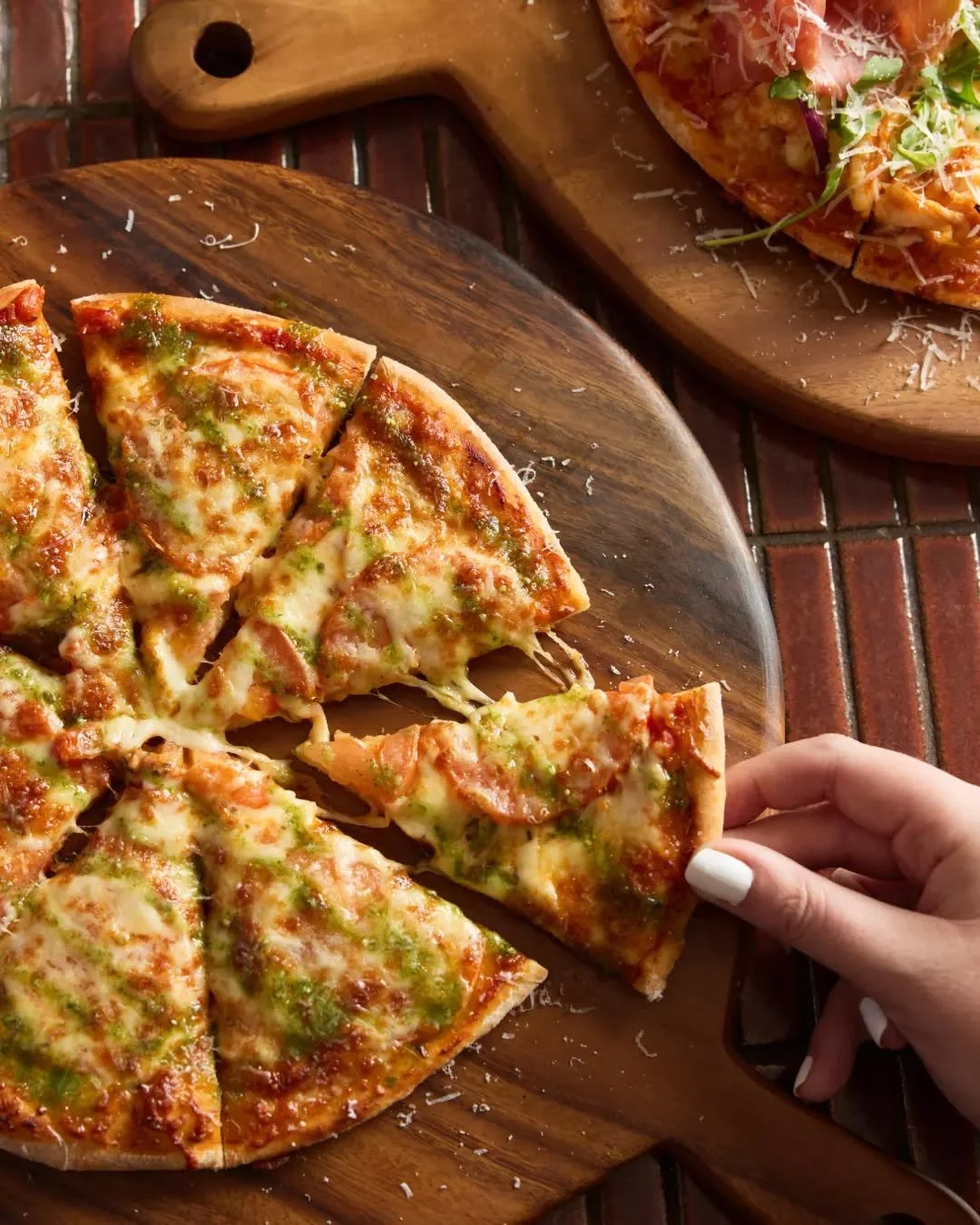 That cheese pull is the start of something delicious...🤤 Vote 1 more beer and pizza in life. 🍕🍺

📍 Public Bar &amp; Beer Garden