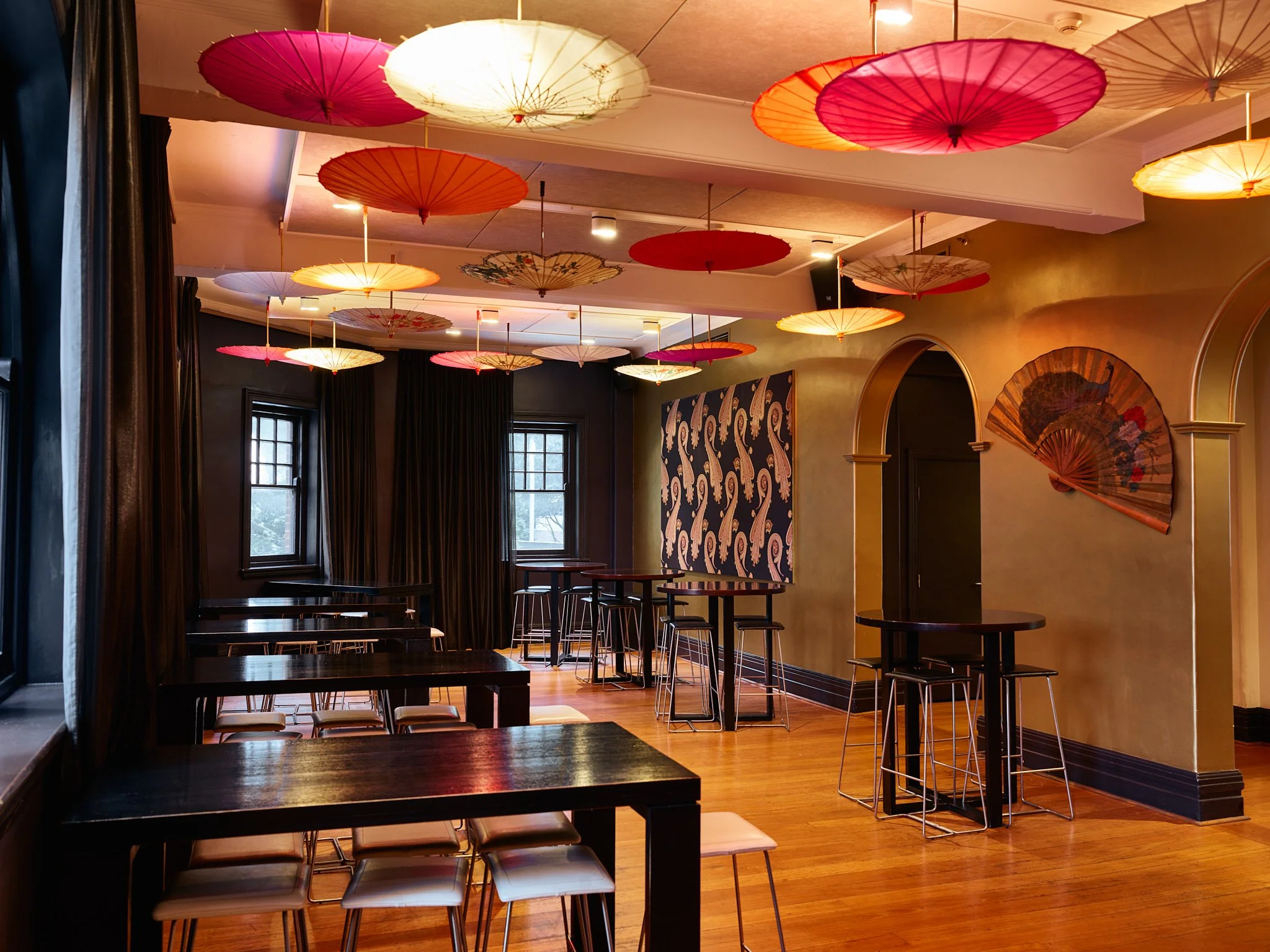 Vibrant dining space, stylish décor, hanging umbrellas