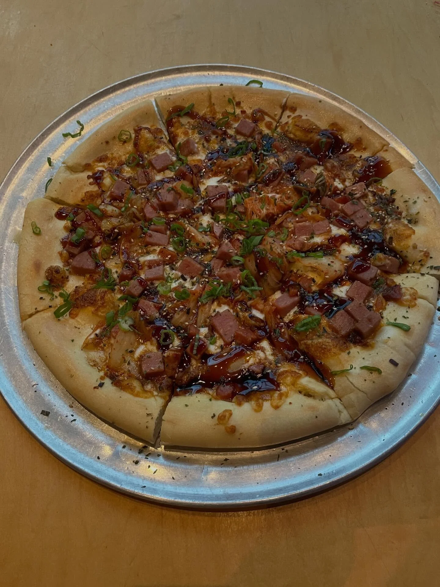 @skyboxtaphouse is changing it up this year with a SPAM &amp; Kimchee Pizza with Unagi Glaze &amp; Furikake. We tried it and loved it! Available this Saturday at @skyboxtaphouse, find their booth fronting the @intlmktplace