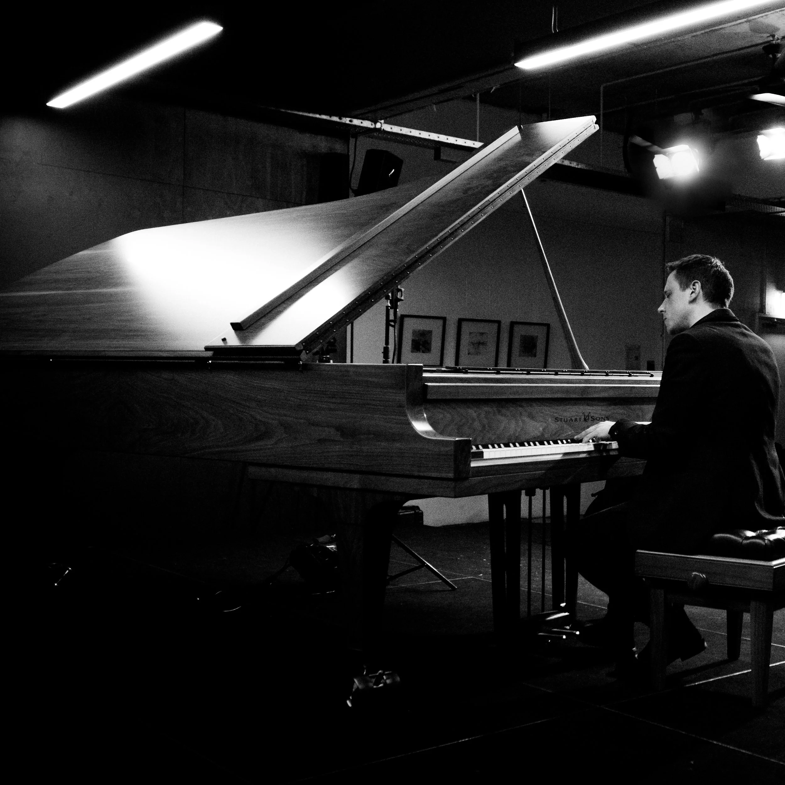 Ross Calia, composer, performing in concert on a grand piano - Melbourne
