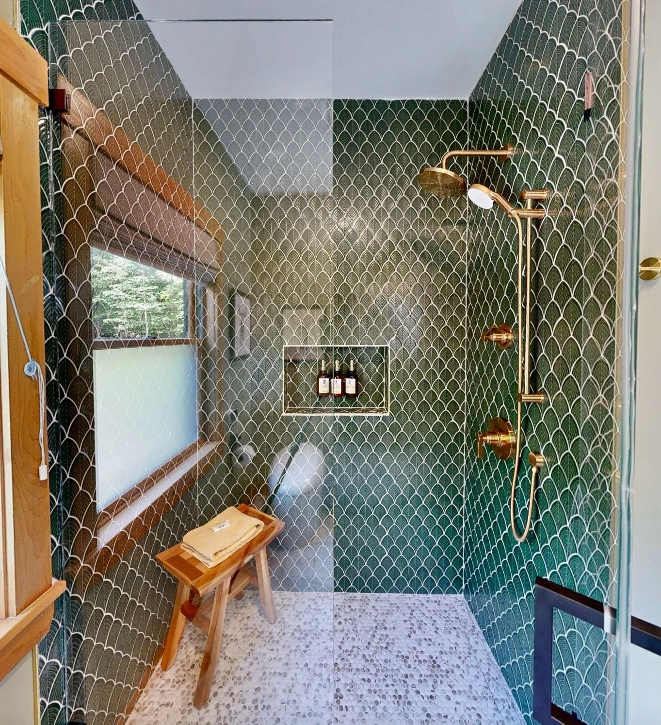 A dramatic before-and-after in this Sunday River bathroom renovation. This rustic Airbnb now features an earthy green palette and a beautifully refreshed shower, creating a serene and elevated retreat. ✨