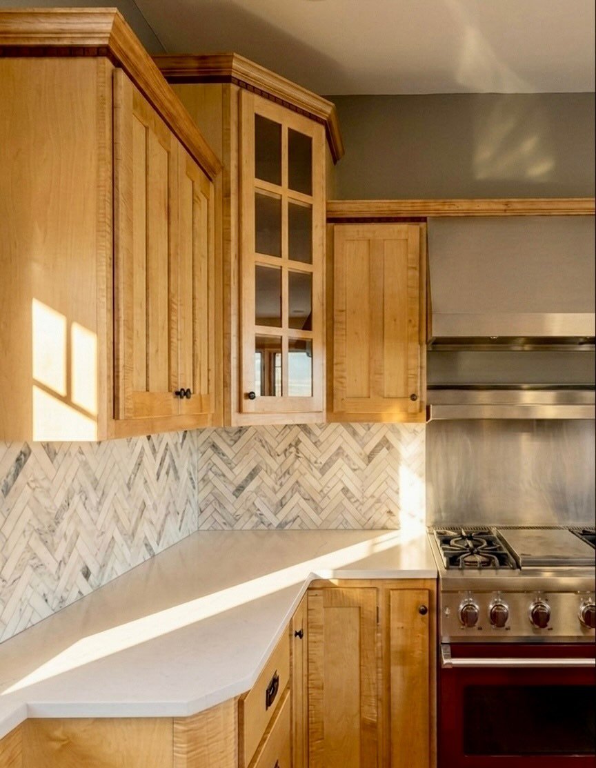 Proof you don&rsquo;t always need a full gut renovation ✨

This client kept her existing cabinets and continued the cherry floors from the rest of the home into the kitchen. We balanced those warm tones with a soft sage green on the walls, then refre