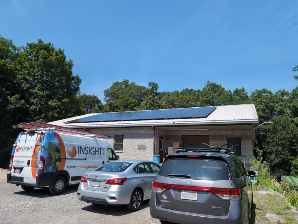 Insight vehicles in front of commercial business after solar installation