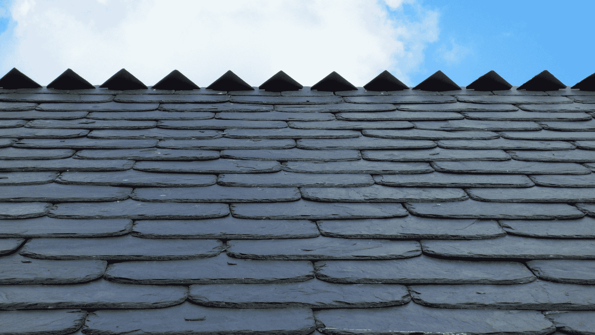 Specialized solar panel installation on a historic slate roof to save money on electricity.
