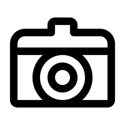 Icon of a camera with a lens in the center