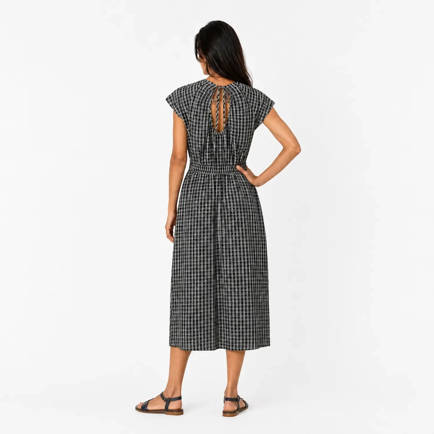 back view of a female virtual model wearing a dress