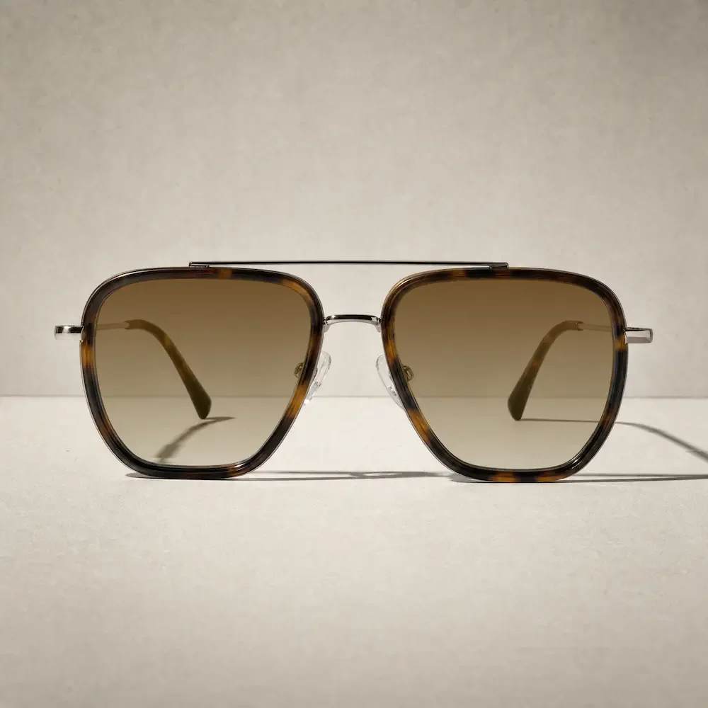 A pair of sunglasses with tortoiseshell frames and brown tinted lenses