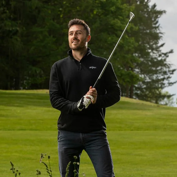 sportswear lifestyle product product photography of a male model playing and wearing a Irony branded top