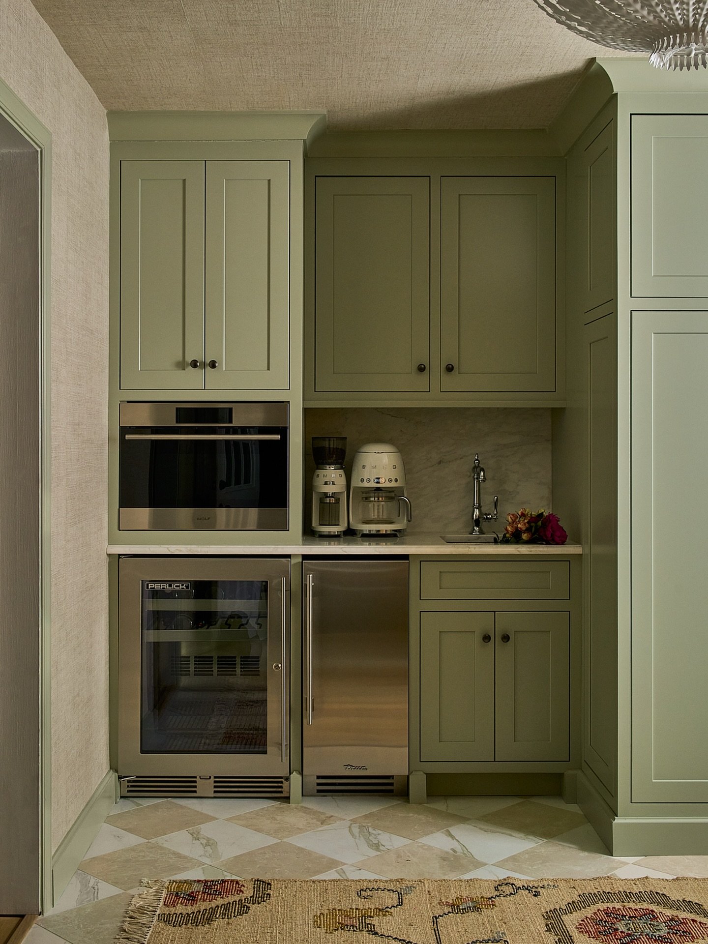 This sweet little extension off the kitchen might just be one of our favorite spots in the house 

Designed to work hard and look pretty, this space functions as a mudroom and packs in so much utility: 
a hidden ice maker
a large pantry with plenty o