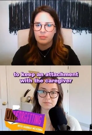 Two women participating in a video call, with one woman in a black shirt and the other in a white shirt, each wearing glasses, in a room with a curtain backdrop and a desk with books and a microphone.