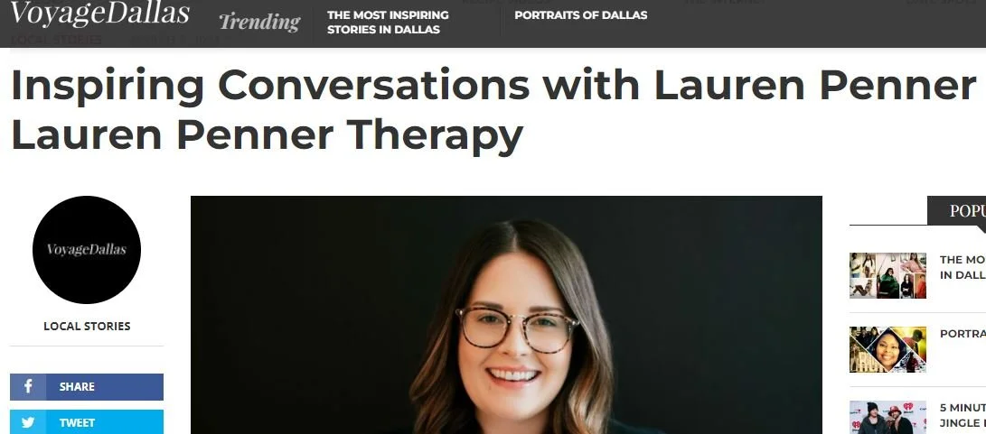 Photograph of a smiling woman with shoulder-length brown hair and glasses, wearing a dark top, set against a black background.