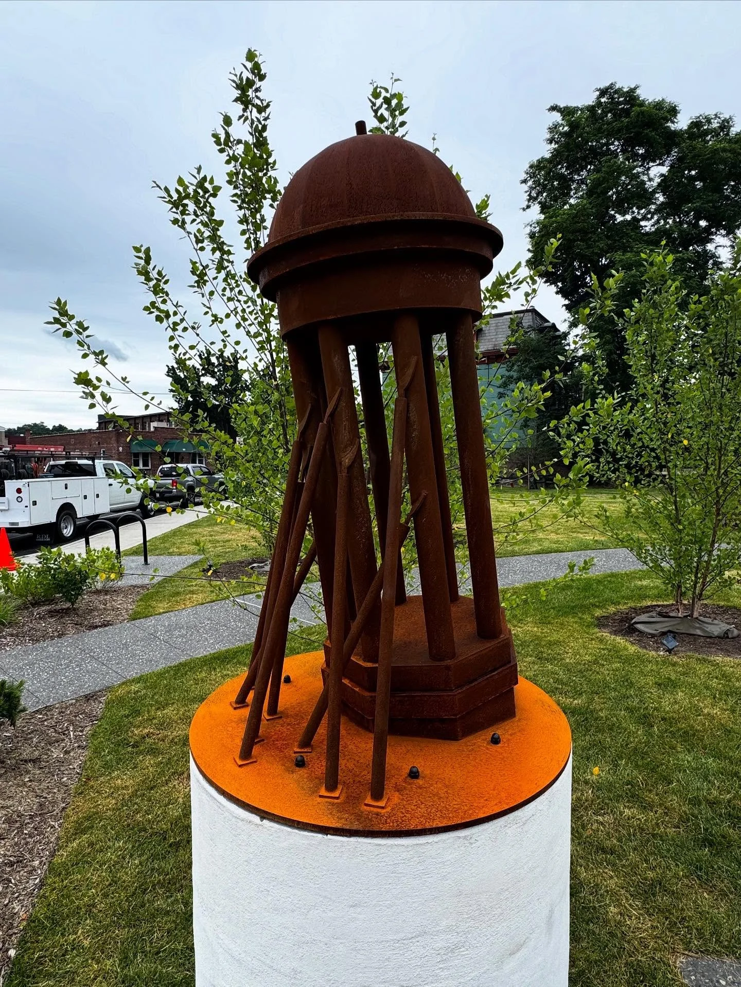 This permanently installed artwork on Broadway in the city of Kingston (NY) was conceived of by artist Richard Scherr to memorialize the old post office that once stood in the parks location. Fabricated in Corten steel.