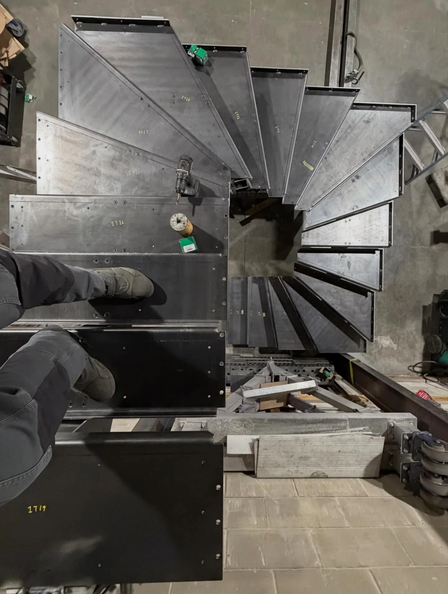 3 flights of centerline stringer stairs, in laser cut 1/4 hot rolled steel. These staircase kits fully dismantle into parts which can be hand carried into the site, due to limited access. Stairs will receive oak treads, and picket rails. Fan style tr