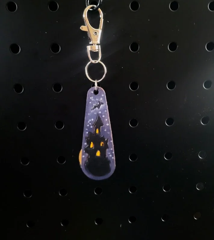 #305 haunted house bag charm