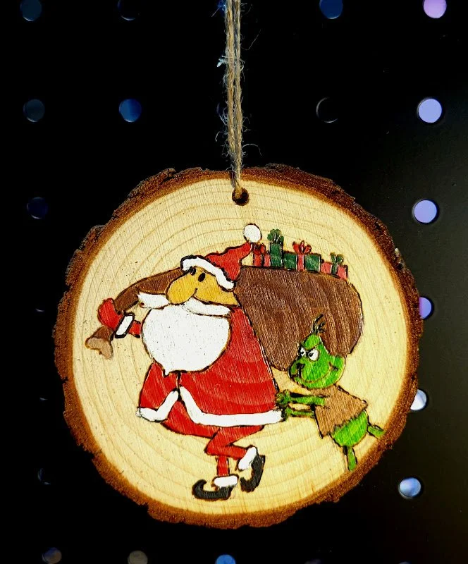 #27-GRINCH BUGGING SANTA ORNAMENT