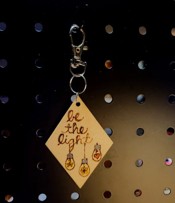 new be the light bag charm.jpg