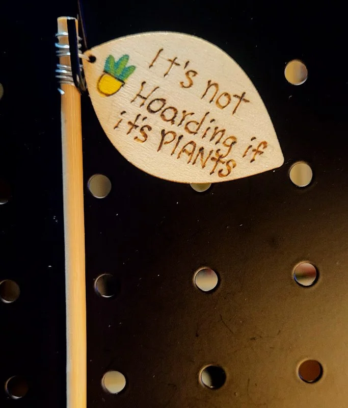 #412 its not hoarding if it's plants- plant sign